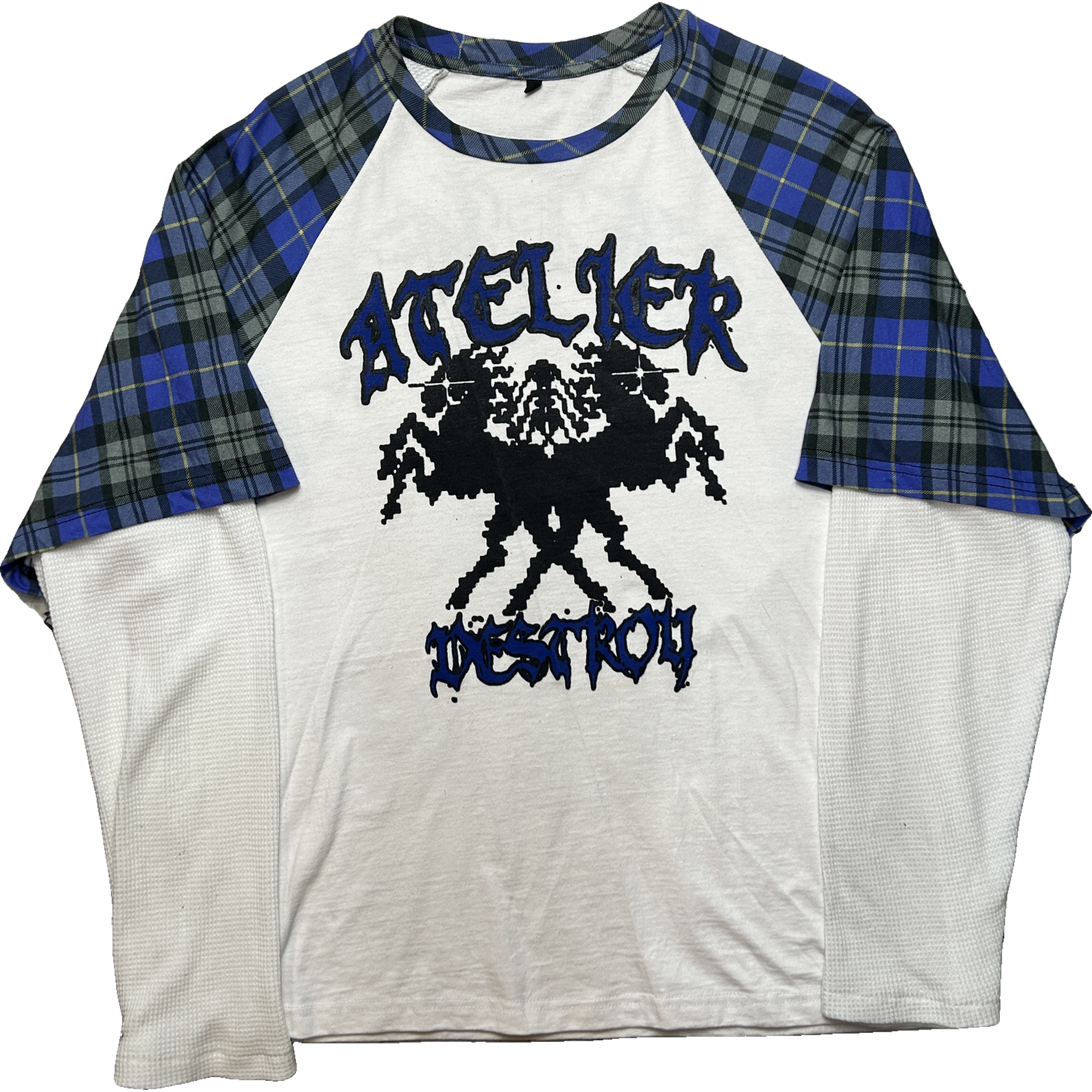A raglan baseball t-shirt with a white body, blue and black plaid sleeves, and a black graphic print on the front featuring the words 'ATTACKER' and 'HONOR'.